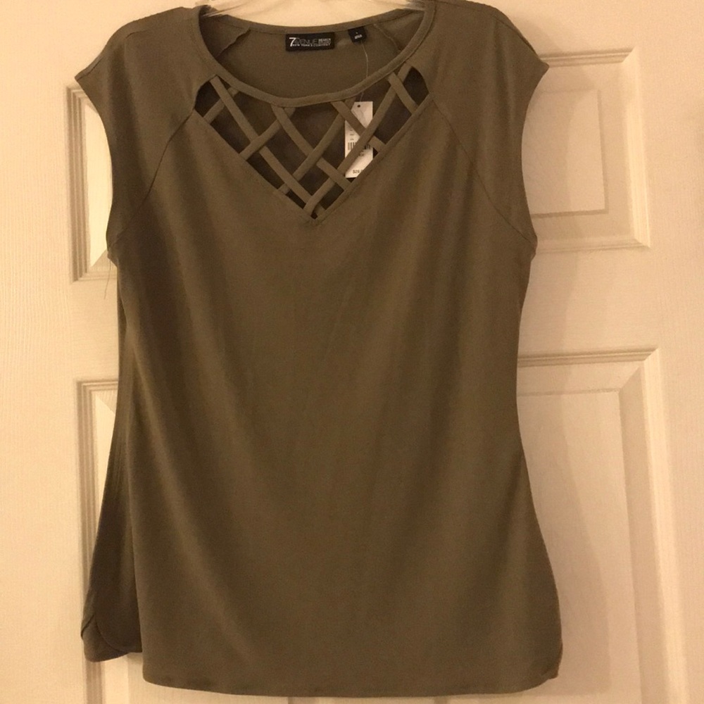 Blouse with criss-cross neck detail.